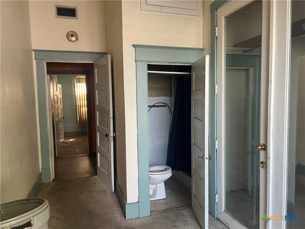 612 South 7th Street Temple, TX 76504 - Photo 18 of 43 a bathroom with a toilet and a shower