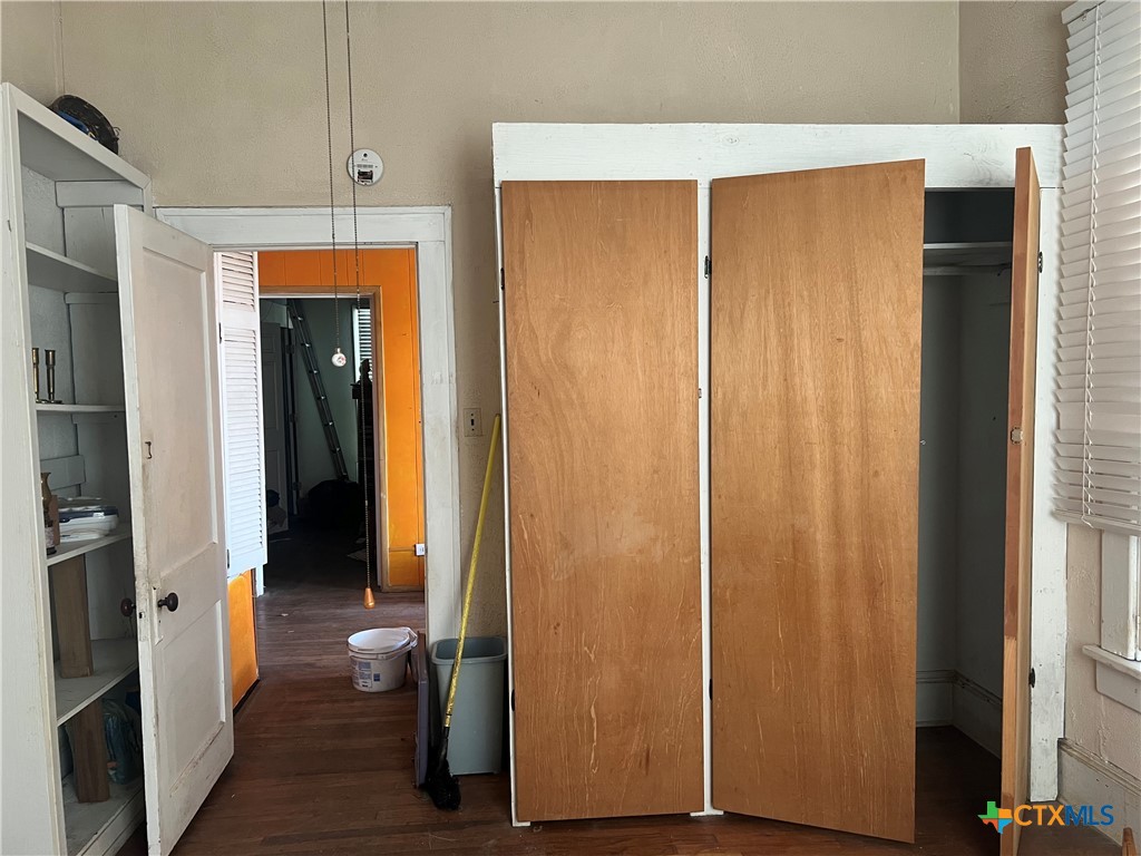 612 South 7th Street Temple, TX 76504 - Photo 7 of 43 a view of closet with wooden floor