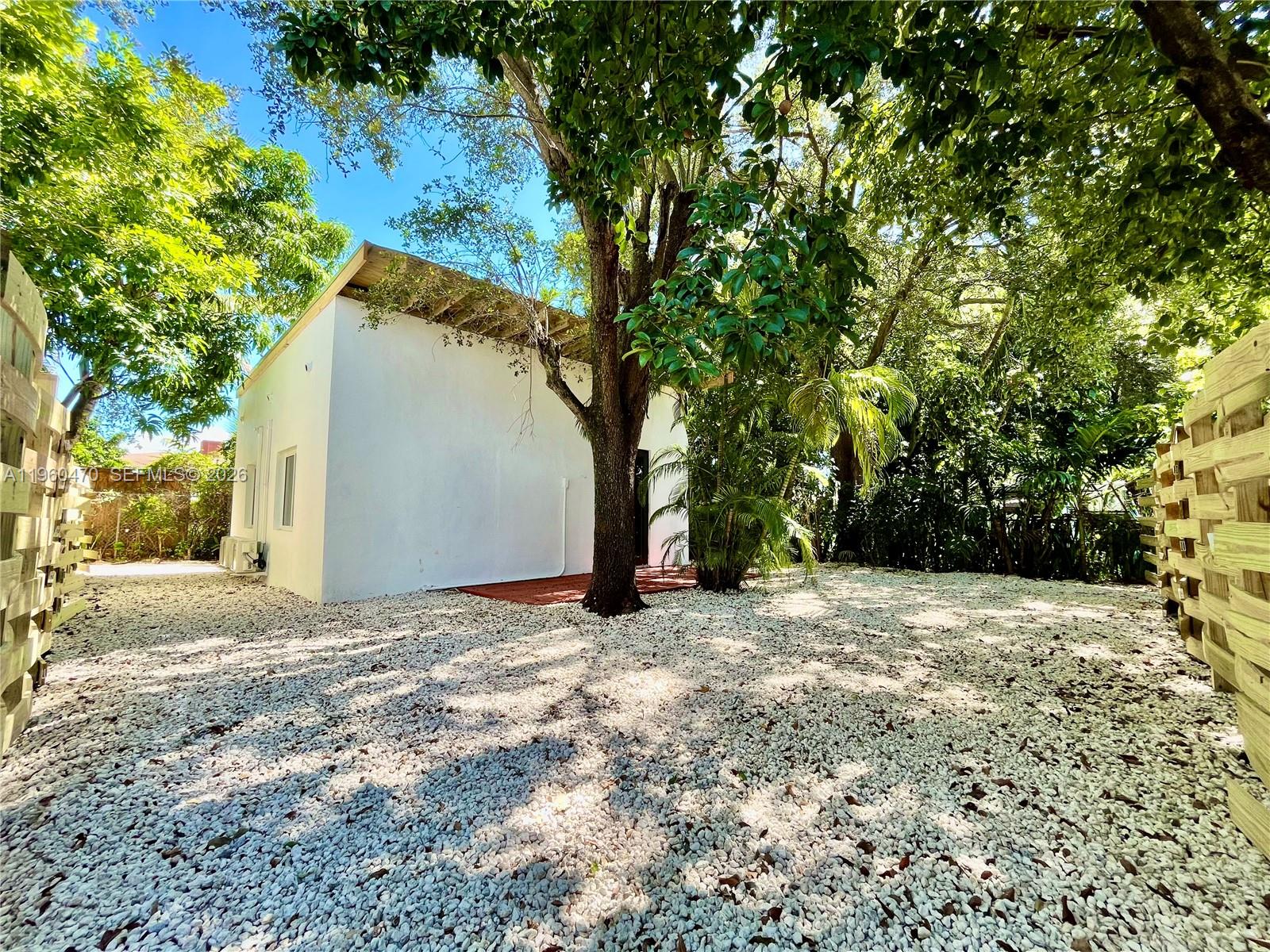 6241 Northwest Miami Place Miami, FL 33150 - Photo 11 of 33 a view of a yard with a tree