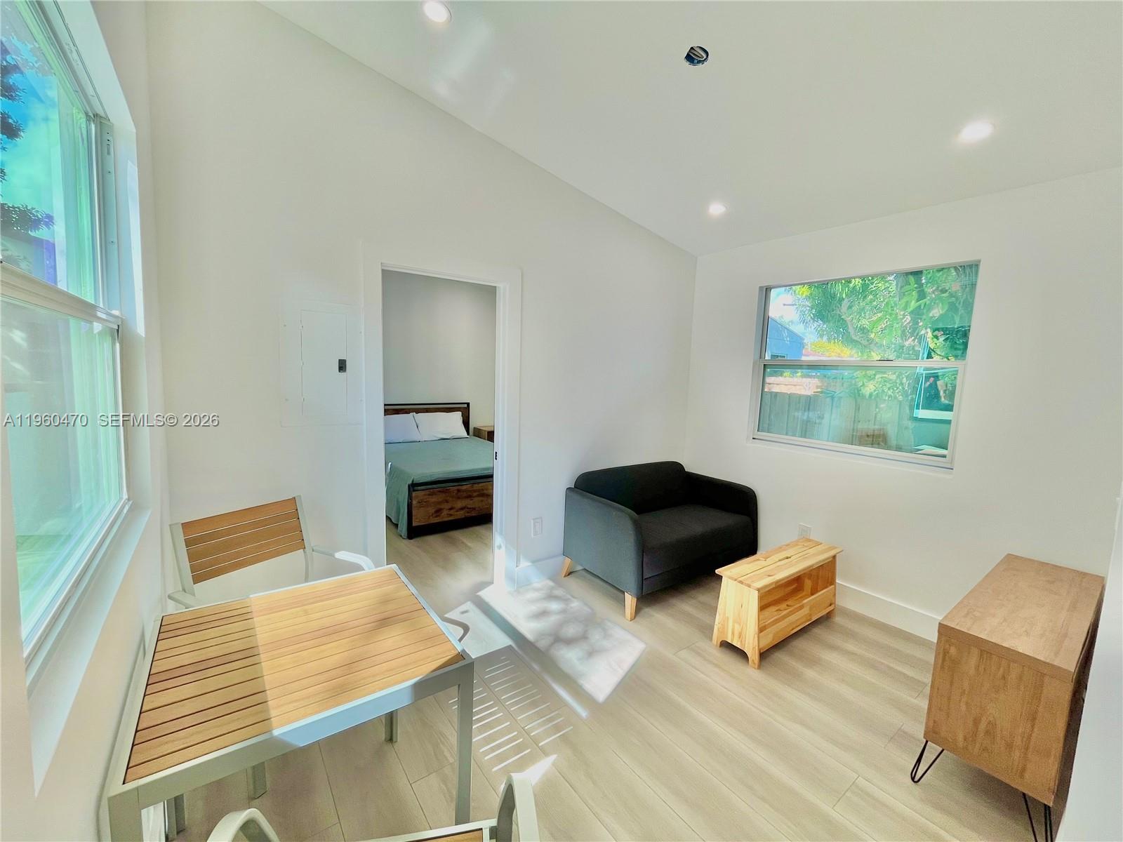 6241 Northwest Miami Place Miami, FL 33150 - Photo 18 of 33 a bedroom with furniture and a window