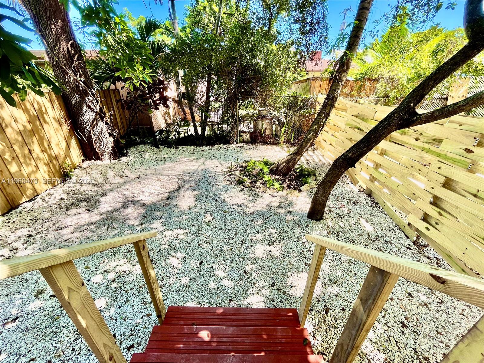 6241 Northwest Miami Place Miami, FL 33150 - Photo 21 of 33 a view of a yard with a tree