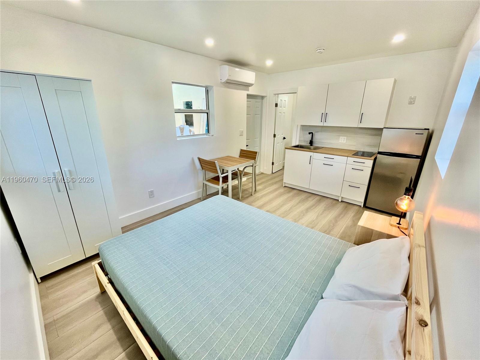 6241 Northwest Miami Place Miami, FL 33150 - Photo 26 of 33 a living room with stainless steel appliances furniture and a kitchen view