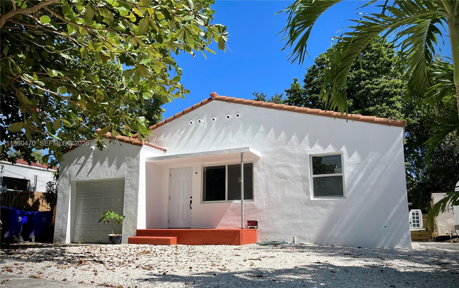 6241 Northwest Miami Place Miami, FL 33150 - Photo 33 of 33 a view of a house with a patio and a yard