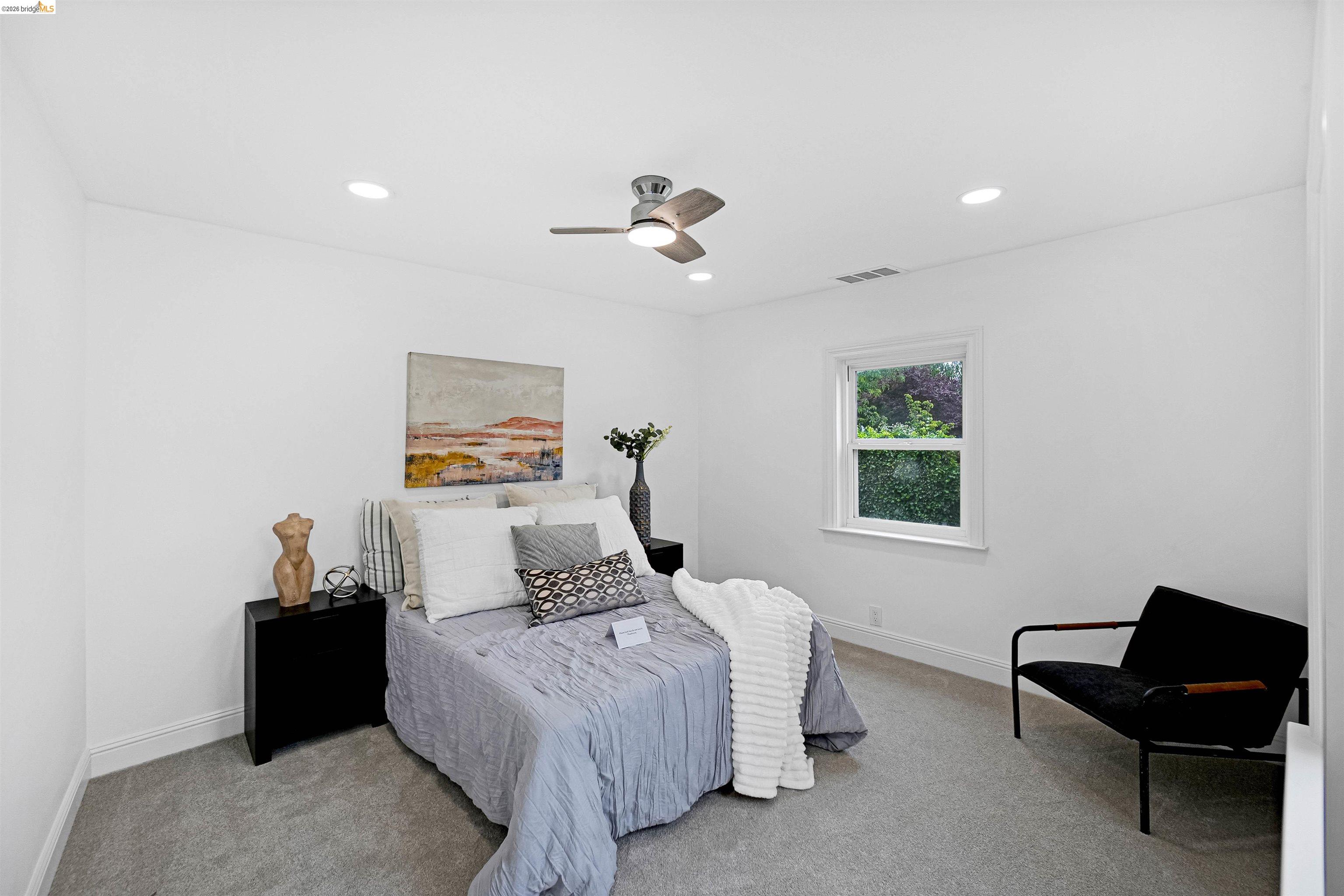 1812 Woolsey Street Berkeley, CA 94703 - Photo 16 of 48 Bright room with recessed lighting and a ceiling fan