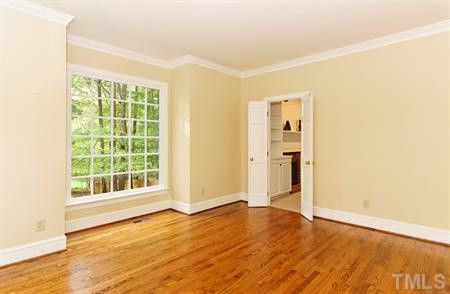 10813 Cahill Road Raleigh, NC 27614 - Photo 4 of 25 Double doors in the formal living room lead to the spacious family room. Living Room