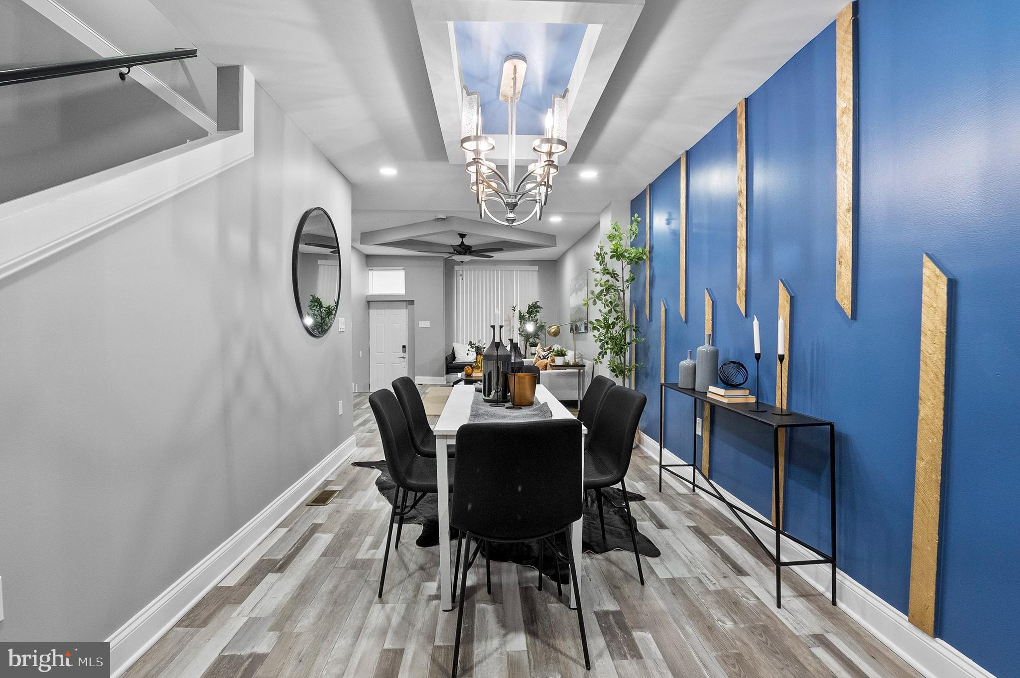1201 North Fulton Avenue Baltimore, MD 21217 - Photo 12 of 36 a view of a dining room with furniture and chandelier