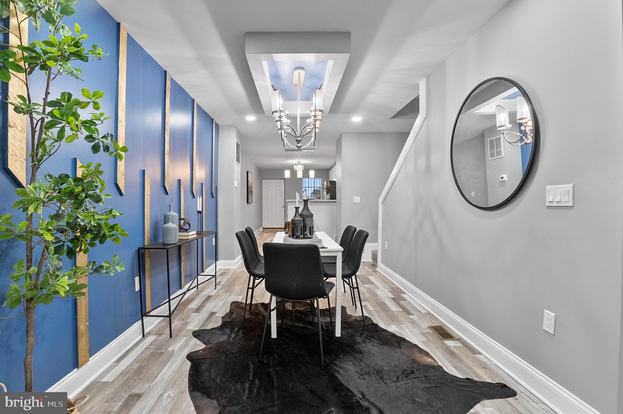 1201 North Fulton Avenue Baltimore, MD 21217 - Photo 13 of 36 a view of a livingroom with furniture and a potted plant