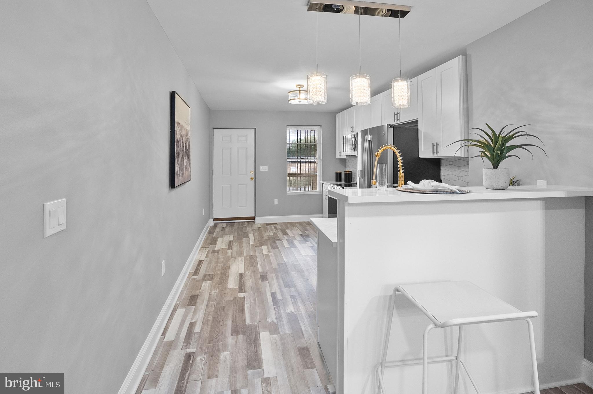 1201 North Fulton Avenue Baltimore, MD 21217 - Photo 14 of 36 a view of kitchen with cabinets and window
