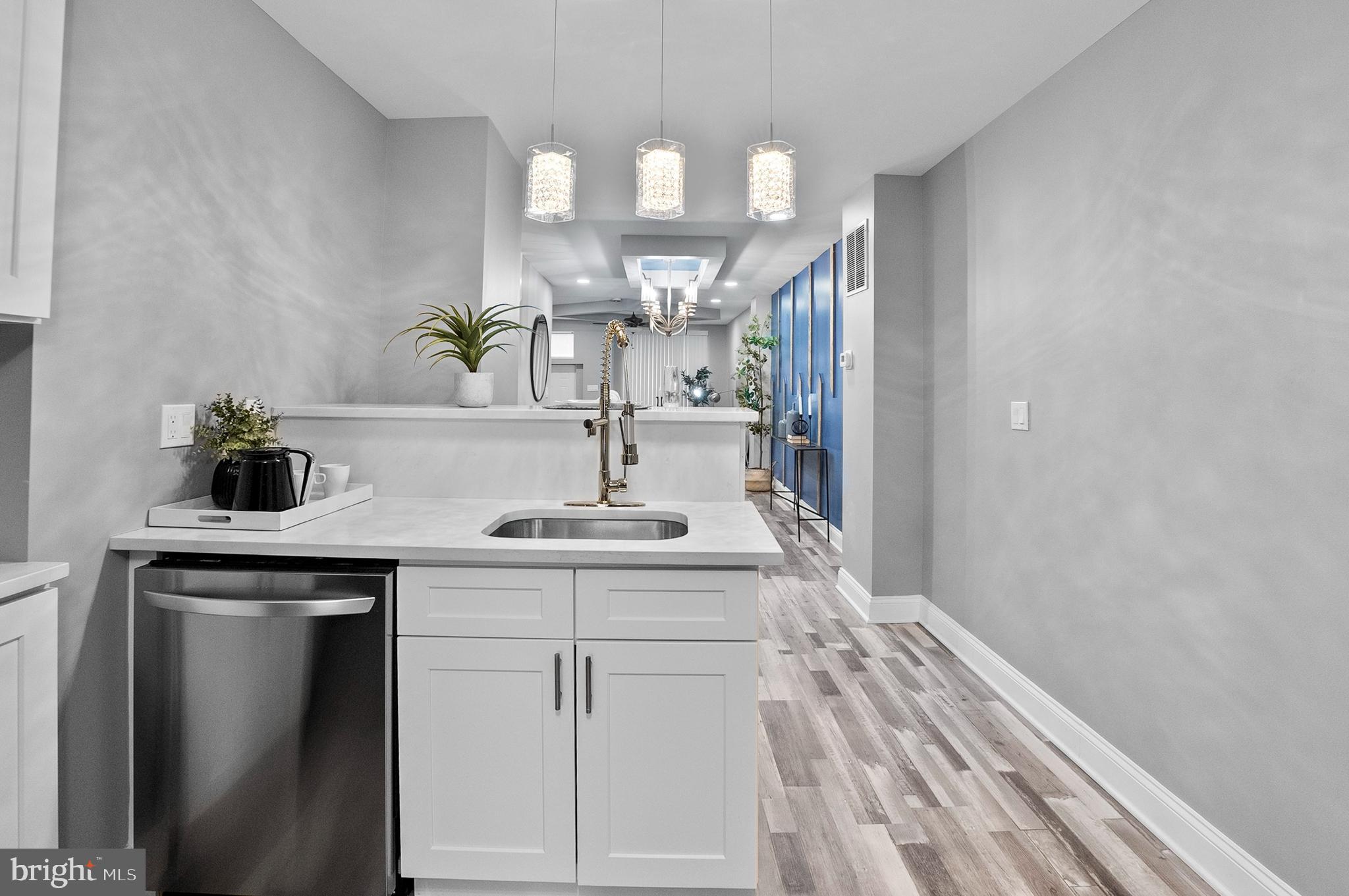 1201 North Fulton Avenue Baltimore, MD 21217 - Photo 16 of 36 a bathroom with a sink and a mirror