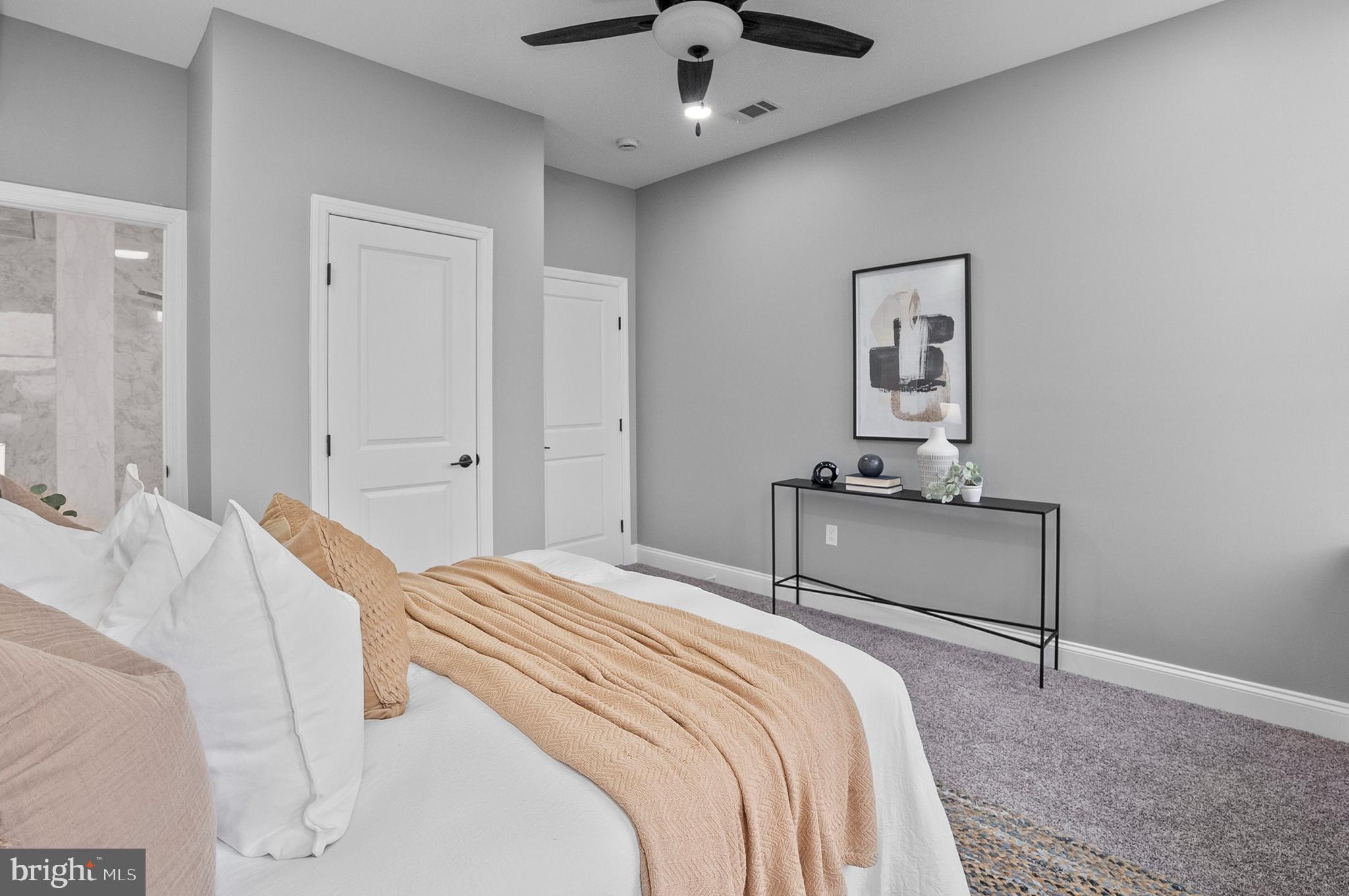 1201 North Fulton Avenue Baltimore, MD 21217 - Photo 18 of 36 a bedroom with a bed and a chandelier