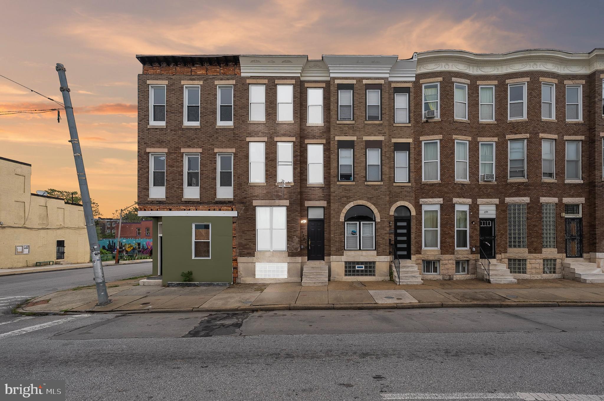 1201 North Fulton Avenue Baltimore, MD 21217 - Photo 2 of 36 a front view of a building with street