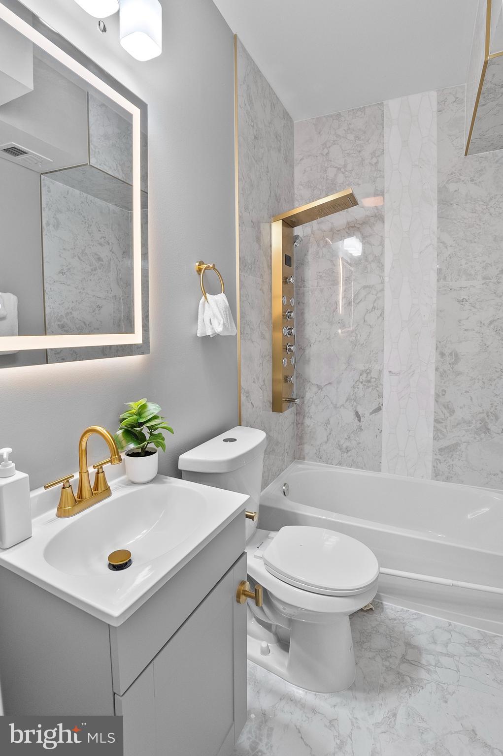 1201 North Fulton Avenue Baltimore, MD 21217 - Photo 24 of 36 a bathroom with a sink a toilet and shower