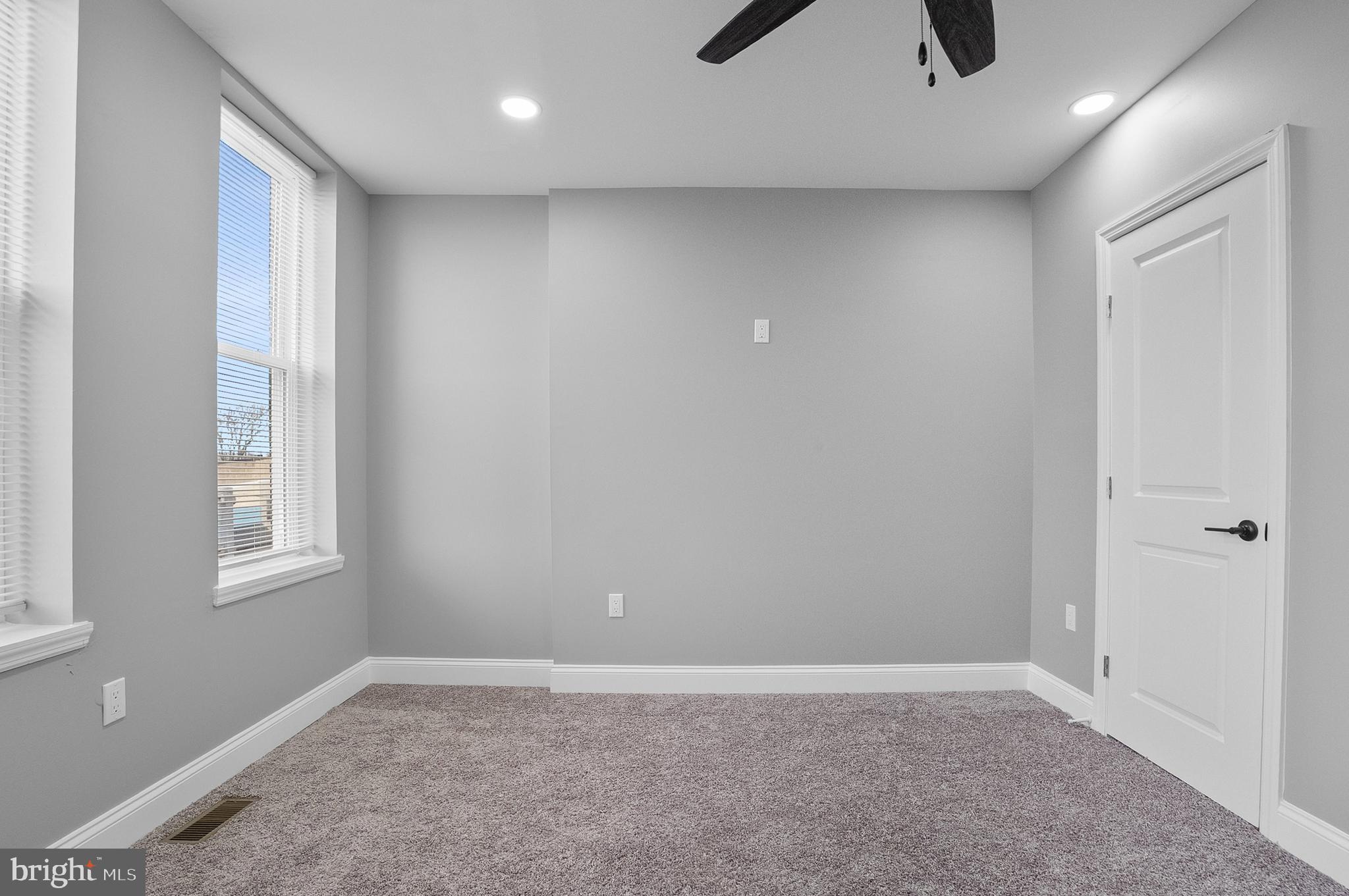 1201 North Fulton Avenue Baltimore, MD 21217 - Photo 26 of 36 an empty room with windows and closet