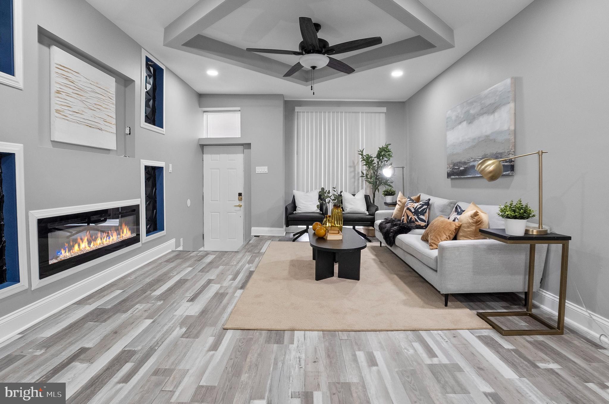 1201 North Fulton Avenue Baltimore, MD 21217 - Photo 3 of 36 a living room with furniture and a fireplace