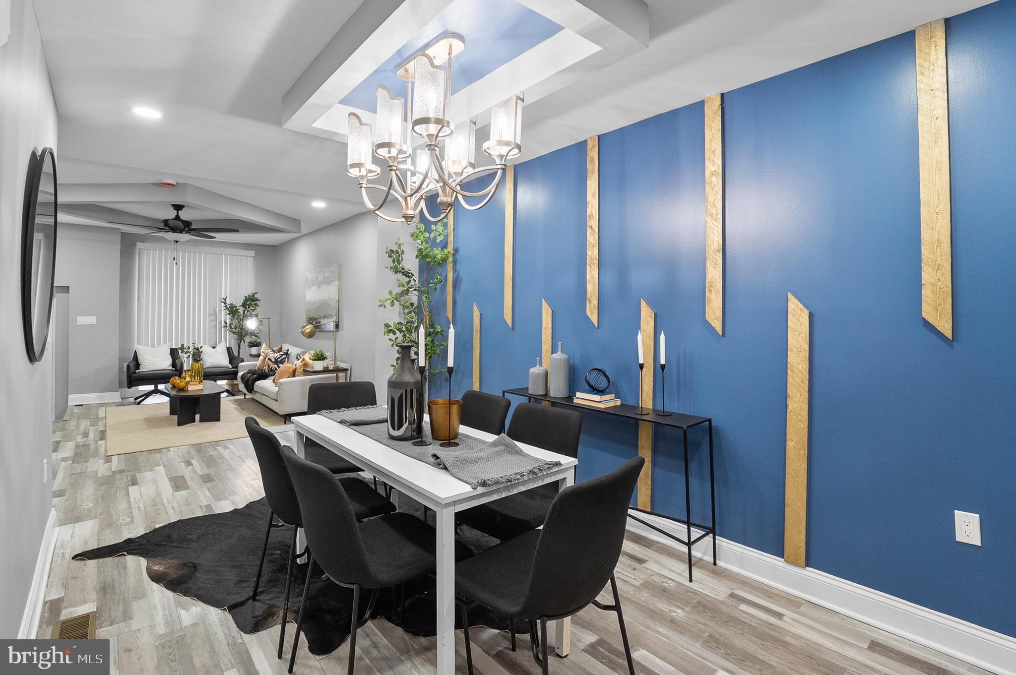 1201 North Fulton Avenue Baltimore, MD 21217 - Photo 5 of 36 a view of a dining room with furniture and chandelier