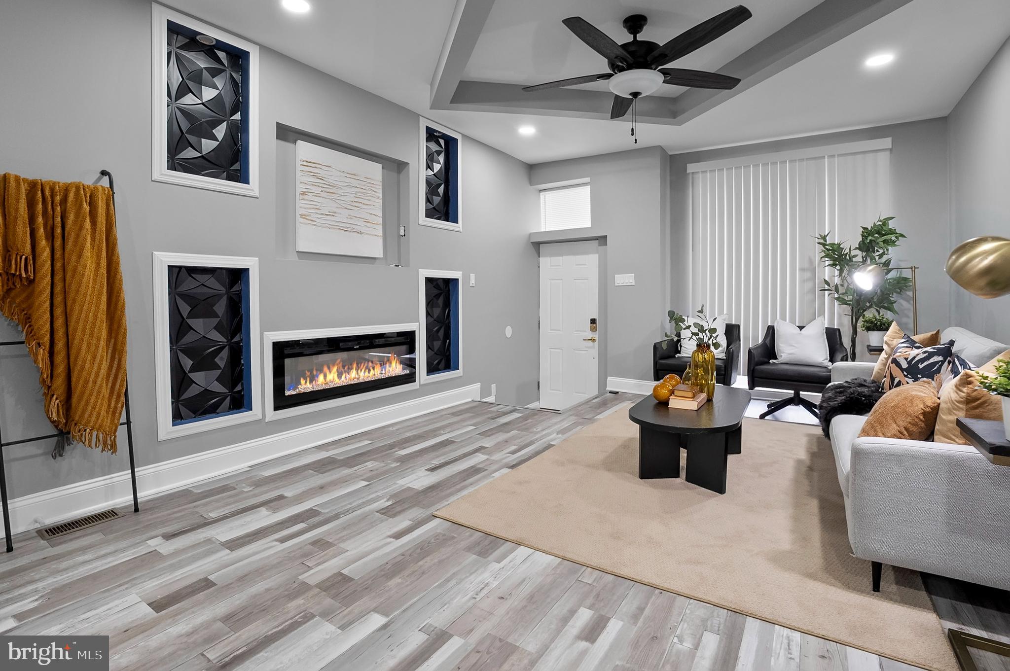 1201 North Fulton Avenue Baltimore, MD 21217 - Photo 10 of 36 a living room with furniture and a fireplace