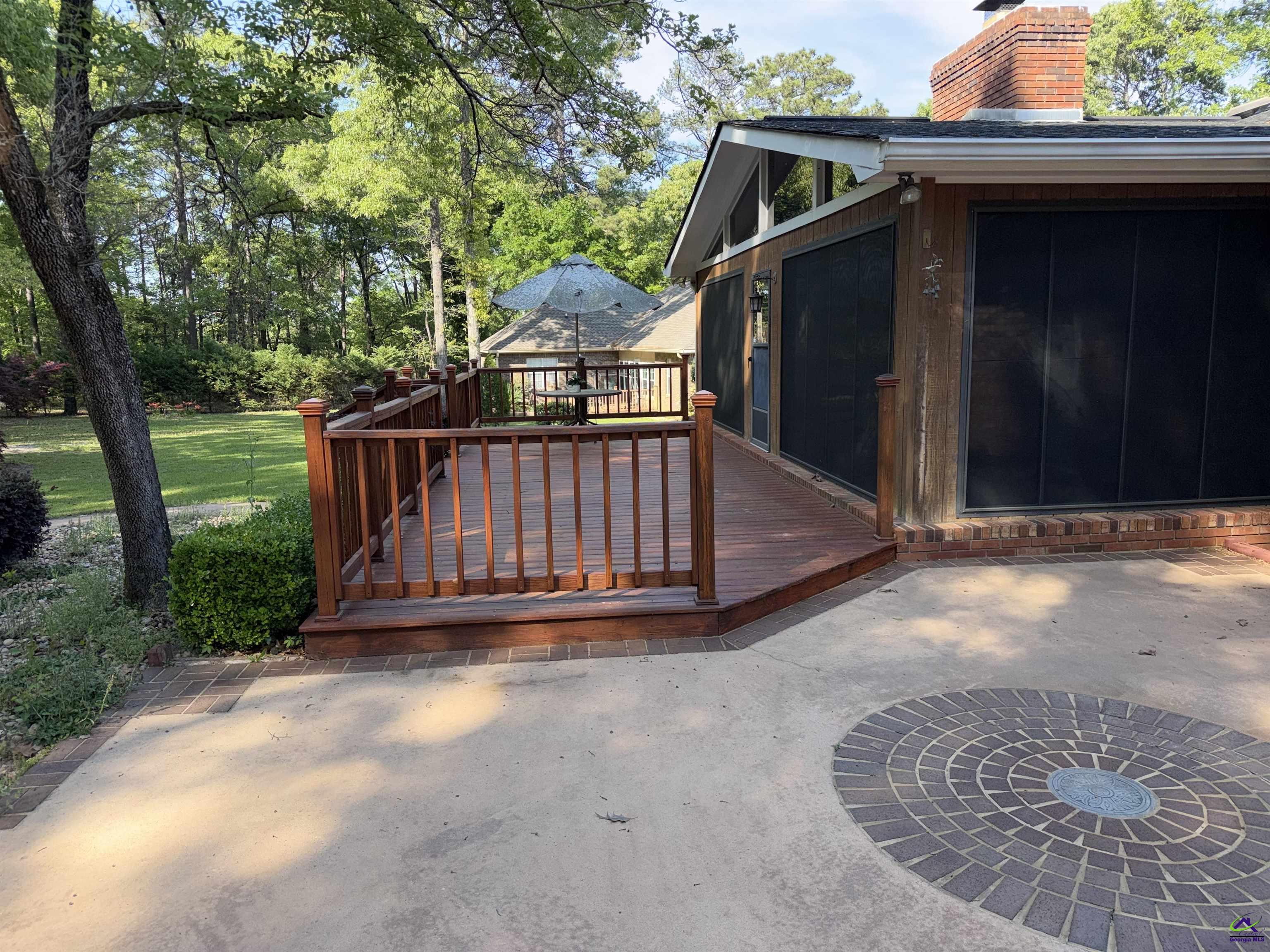 249 Hatcher Road Warner Robins, GA 31088 - Photo 6 of 25 a view of backyard with small cabin and wooden fence