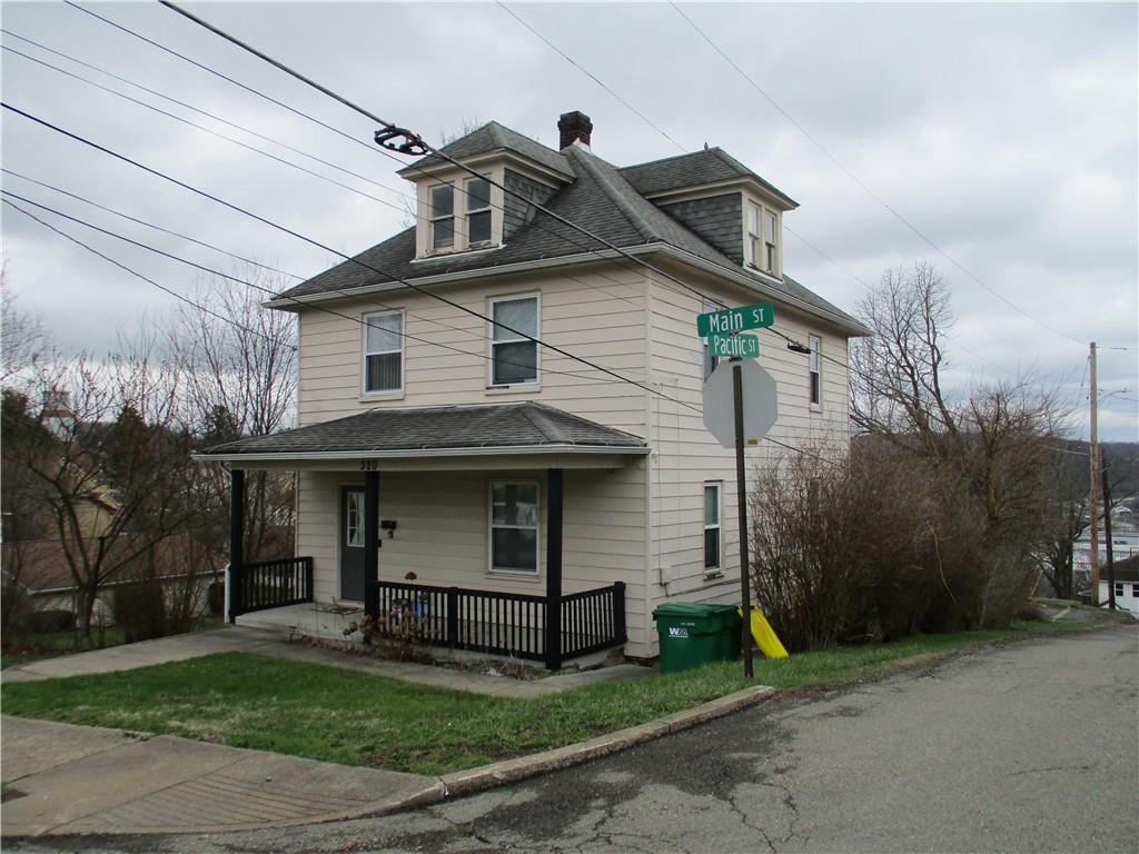 320 Main Street Lyndora, PA 16045 - Photo 1 of 11 a view of a white house with large windows and a yard