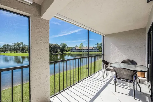 a view of a balcony with two chairs and a table
