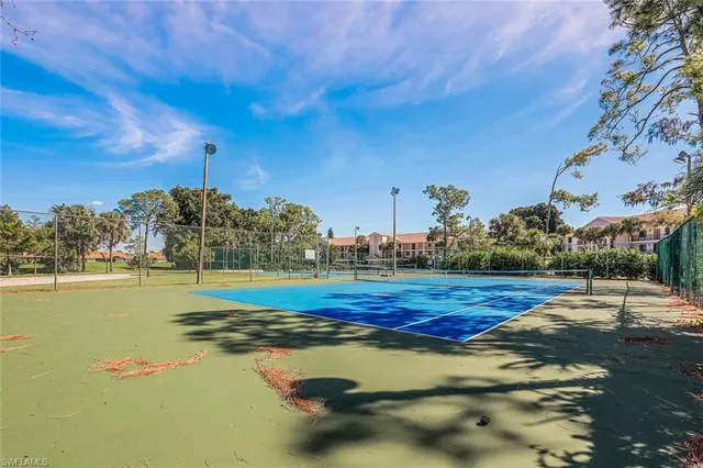 a view of a swimming pool with an outdoor space and seating area