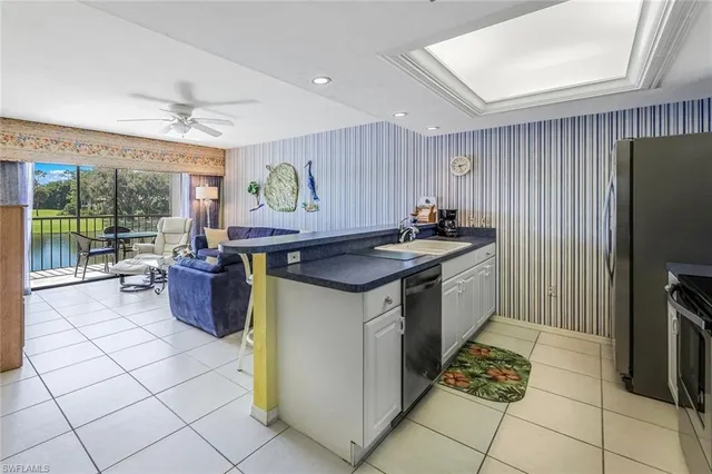 a kitchen with a stove a sink and a refrigerator