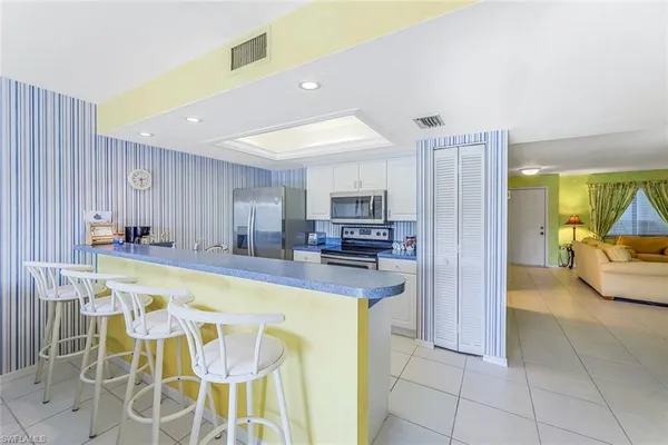 a view of a kitchen center island and dining table