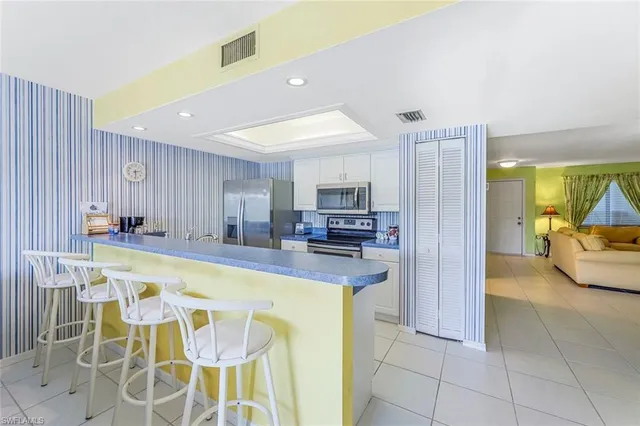 a view of a kitchen center island and dining table