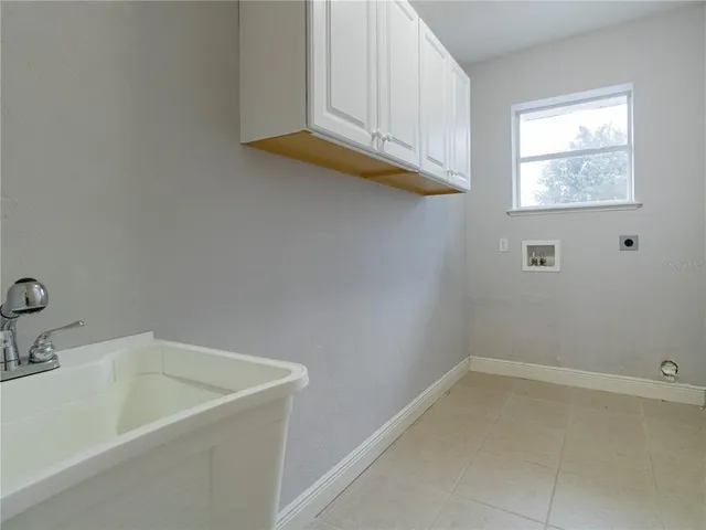 a bathroom with a sink and window