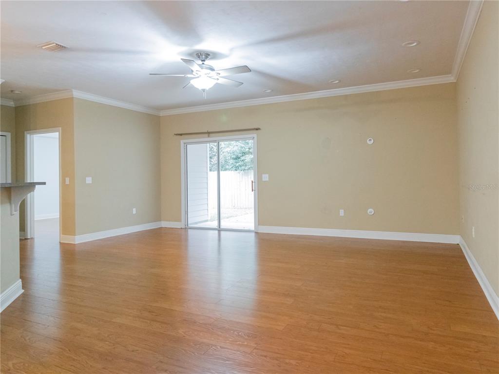 14001 Northwest 9th Road Newberry, FL 32669 - Photo 7 of 17 wooden floor in an empty room with a window