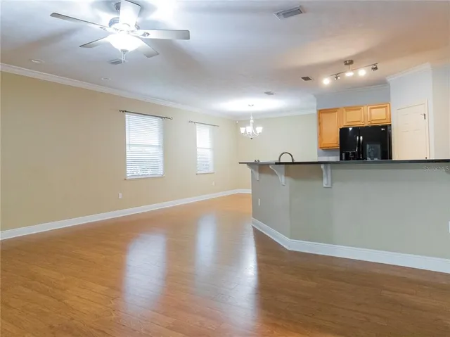 a view of a kitchen with a sink and a window