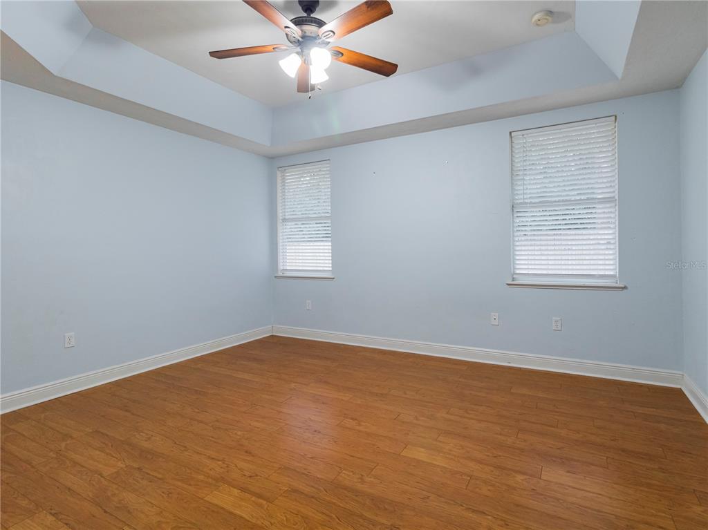 14001 Northwest 9th Road Newberry, FL 32669 - Photo 9 of 17 an empty room with a window and a fan