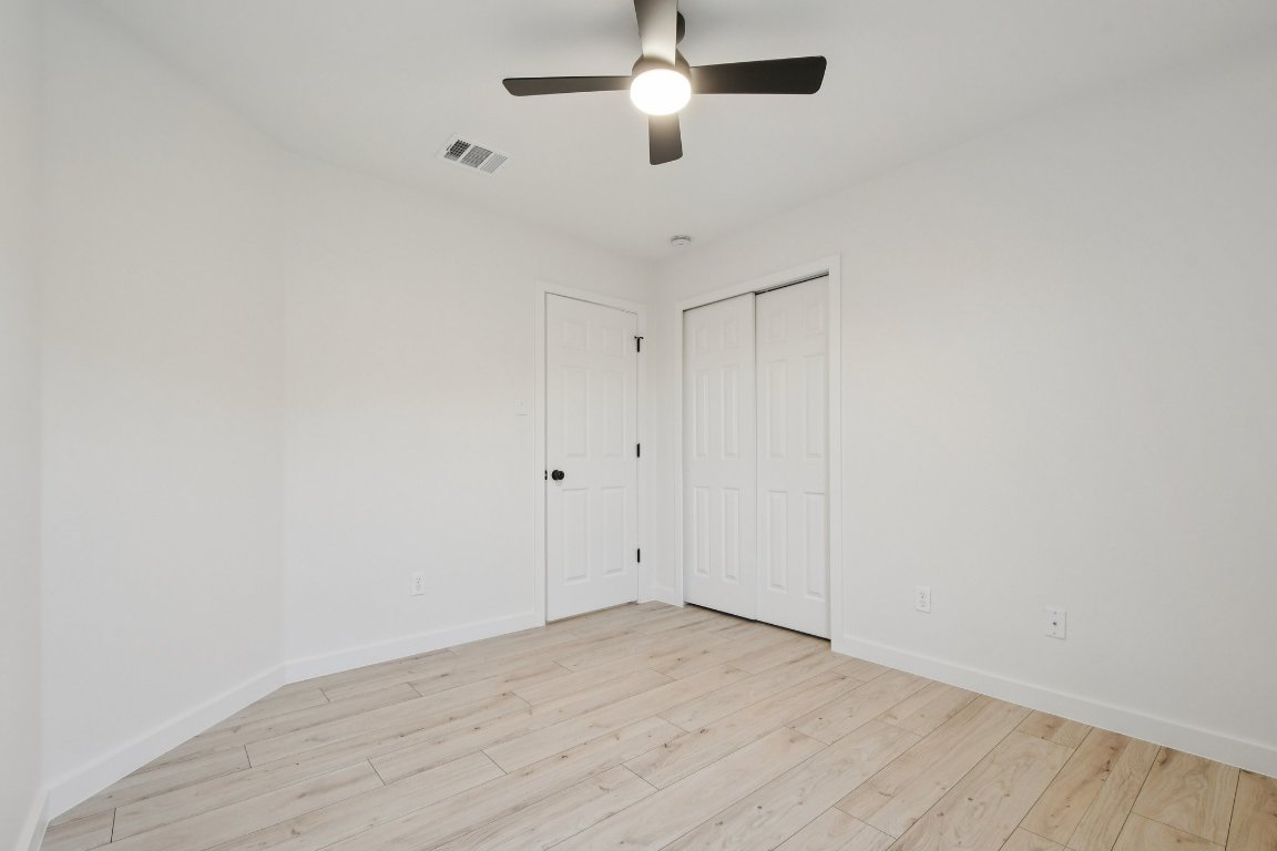 17921 Basket Flower Bend Elgin, TX 78621 - Photo 29 of 40 a view of an empty room with wooden floor