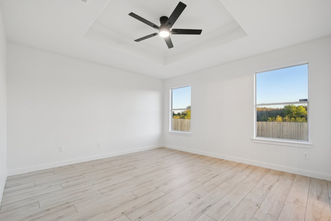 17921 Basket Flower Bend Elgin, TX 78621 - Photo 30 of 40 wooden floor in an empty room with a window