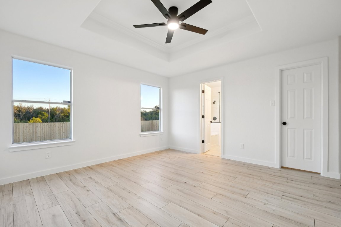 17921 Basket Flower Bend Elgin, TX 78621 - Photo 34 of 40 a view of an empty room with a window and wooden floor