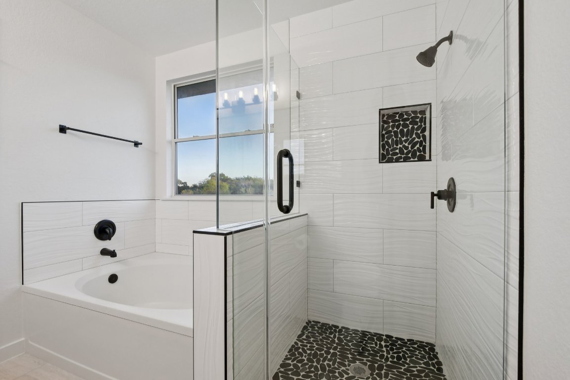 17921 Basket Flower Bend Elgin, TX 78621 - Photo 36 of 40 a bathroom with a shower