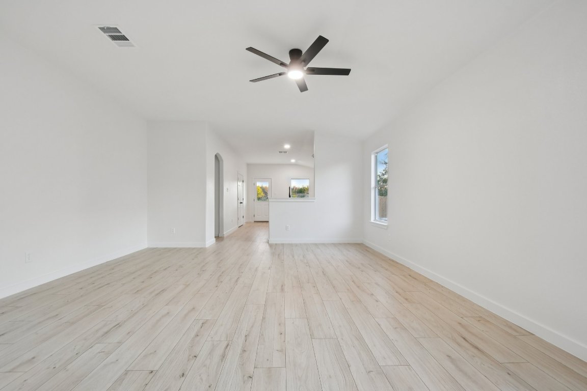 17921 Basket Flower Bend Elgin, TX 78621 - Photo 8 of 40 a view of an empty room and wooden floor