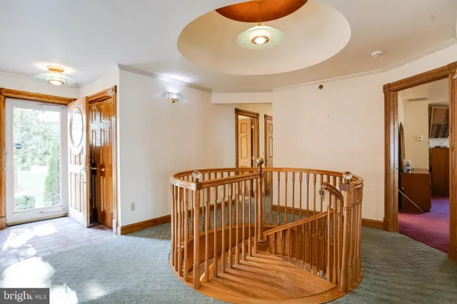 a large kitchen with stainless steel appliances kitchen island granite countertop a refrigerator a stove a sink dishwasher a dining table and chairs with wooden floor