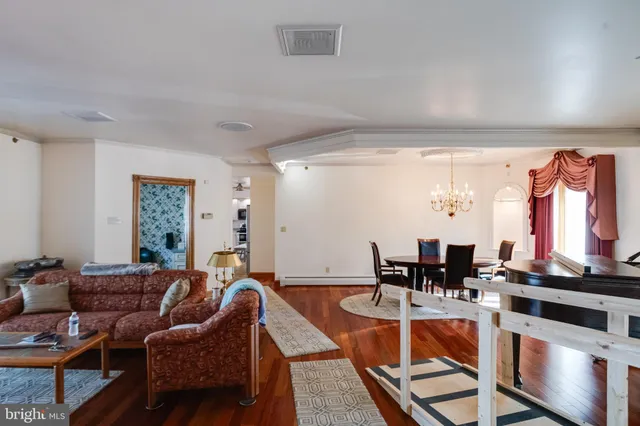a kitchen with kitchen island granite countertop a sink appliances cabinets and a counter top space