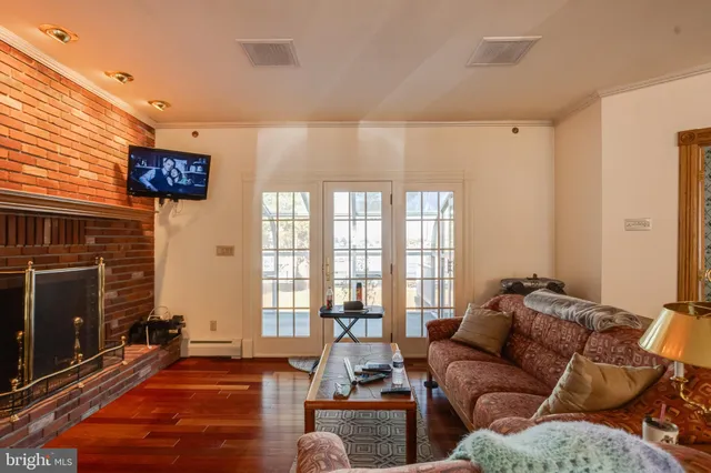a kitchen with granite countertop lots of white cabinets and stainless steel appliances