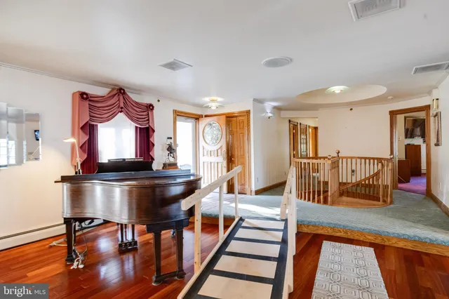 an empty room with a empty space and windows