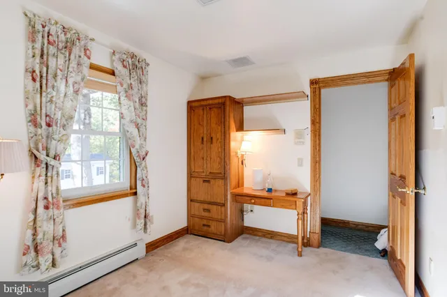 an aerial view of a house with a lake view