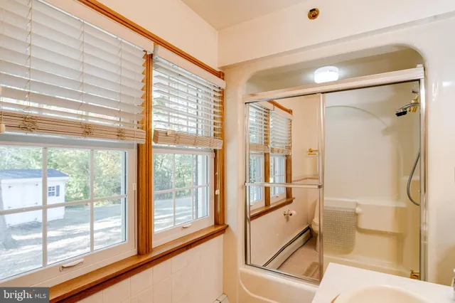 a view of outdoor space with swimming pool and barbeque oven