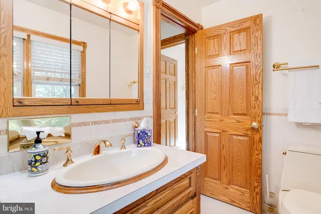 an aerial view of a house with a yard and garden