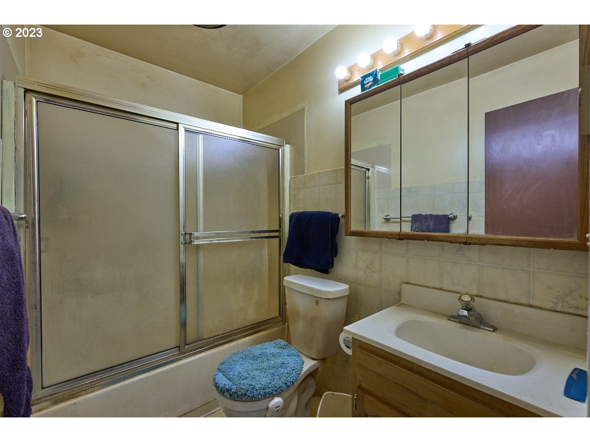 502 Southeast Evans Lane Enterprise, OR 97828 - Photo 14 of 18 a bathroom with a sink a toilet and mirror