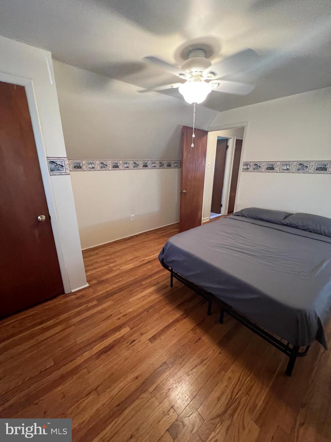 301 Murray Avenue Bellmawr, NJ 08031 - Photo 17 of 36 a living room with a bed furniture and a window