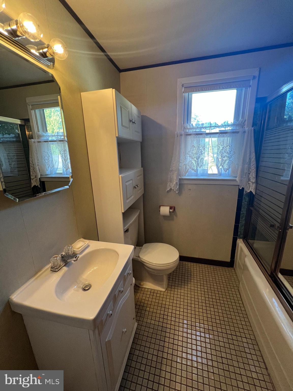 301 Murray Avenue Bellmawr, NJ 08031 - Photo 18 of 36 a bathroom with a sink toilet and mirror