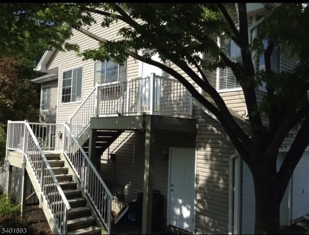 a view of a house with a tree