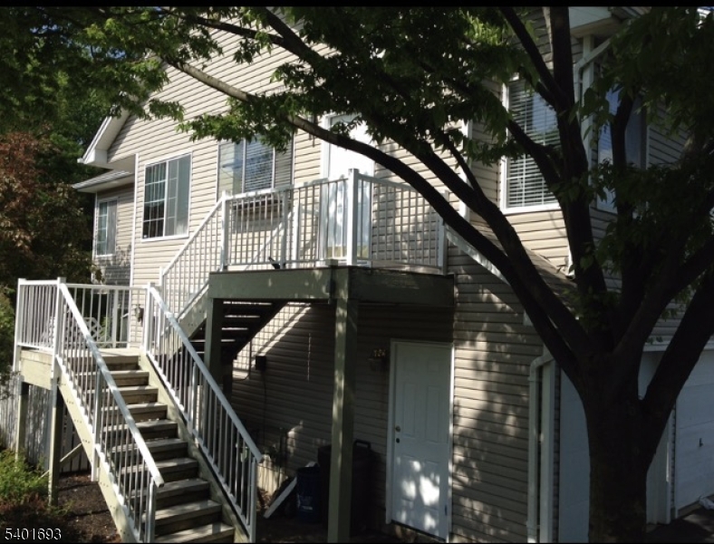 a view of a house with a tree