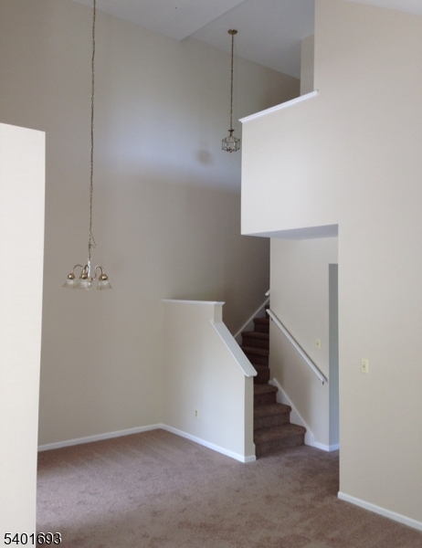 16 Stevens Court Bedminster, NJ 07921 - Photo 2 of 9 a view of a hallway with staircase