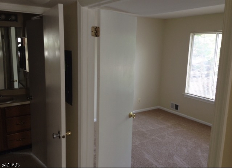 16 Stevens Court Bedminster, NJ 07921 - Photo 7 of 9 a view of an empty room with a window